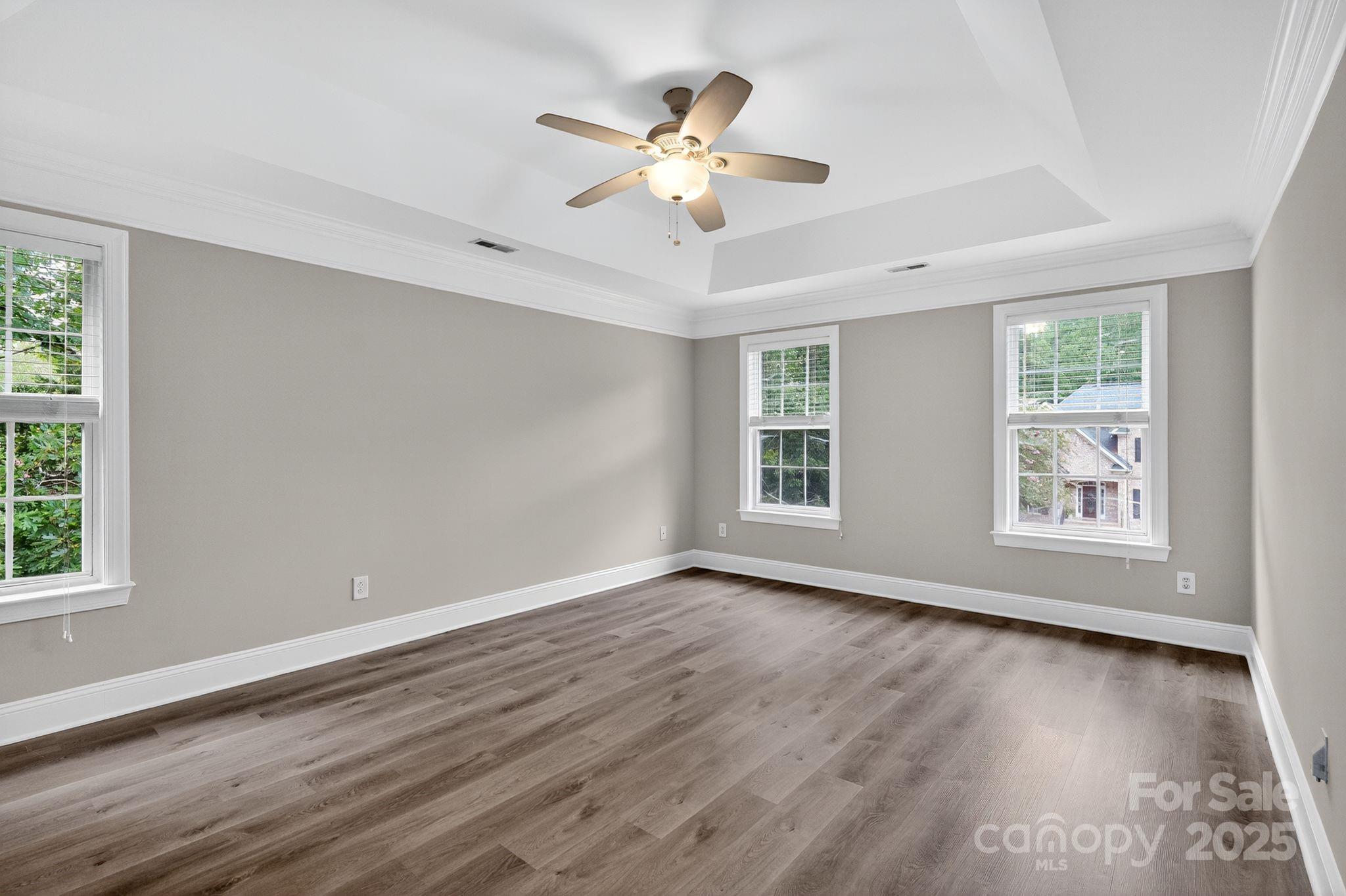 1000 Potters Bluff Road Monroe, NC 28110 - Photo 8 of 20 a view of an empty room with wooden floor and a window