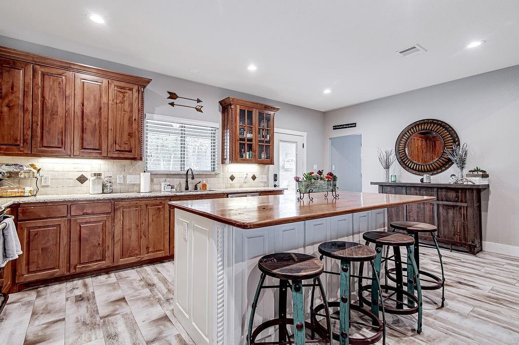 3817 Cross Timber Road Burleson, TX 76028 - Photo 16 of 36 a kitchen with a sink and cabinets