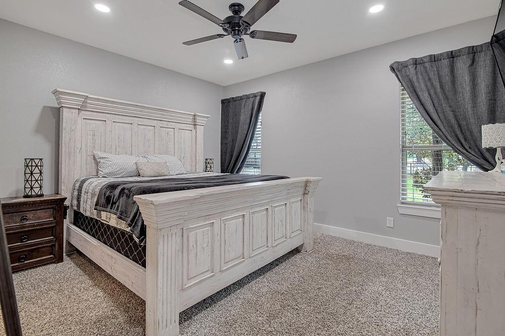 3817 Cross Timber Road Burleson, TX 76028 - Photo 23 of 36 a bedroom with a bed next to a window