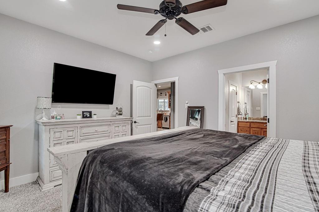 3817 Cross Timber Road Burleson, TX 76028 - Photo 24 of 36 a bedroom with a bed and a flat screen tv