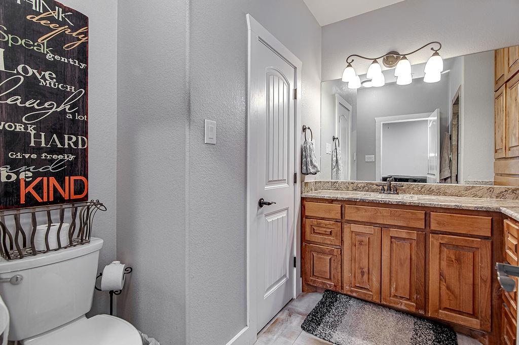 3817 Cross Timber Road Burleson, TX 76028 - Photo 26 of 36 a bathroom with a double vanity sink and a mirror