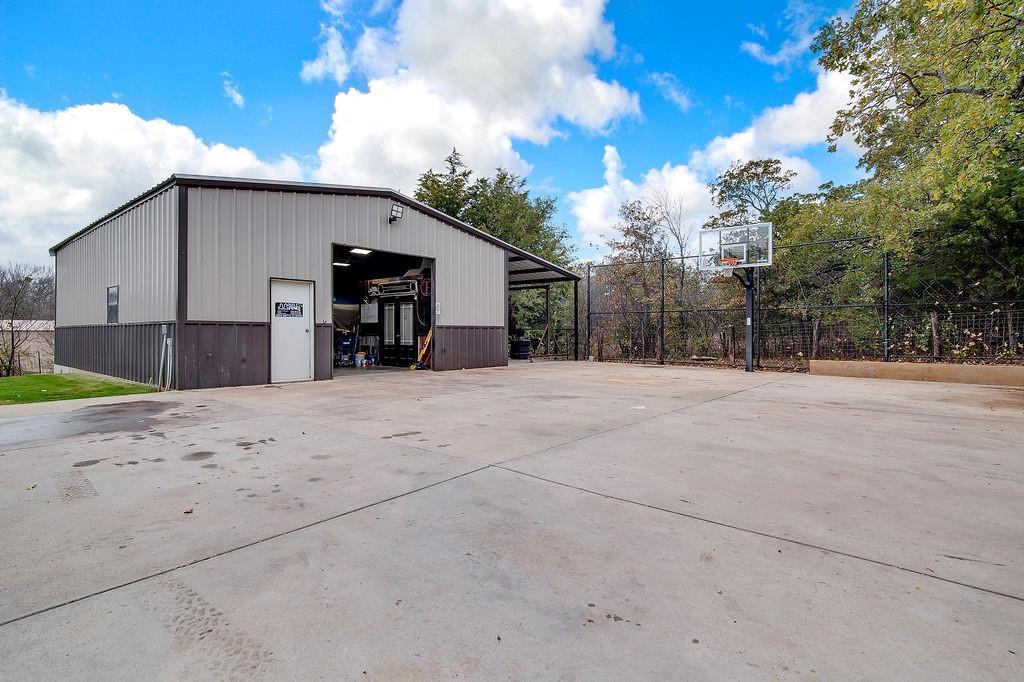 3817 Cross Timber Road Burleson, TX 76028 - Photo 33 of 36 a view of a house with a yard and garage