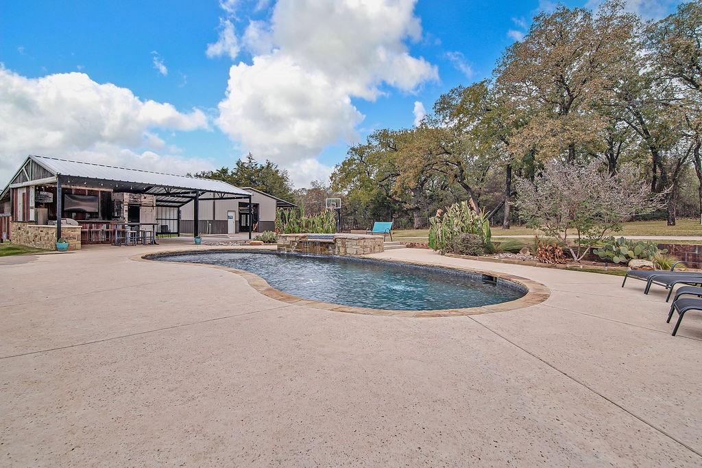 3817 Cross Timber Road Burleson, TX 76028 - Photo 7 of 36 a view of a swimming pool with a yard