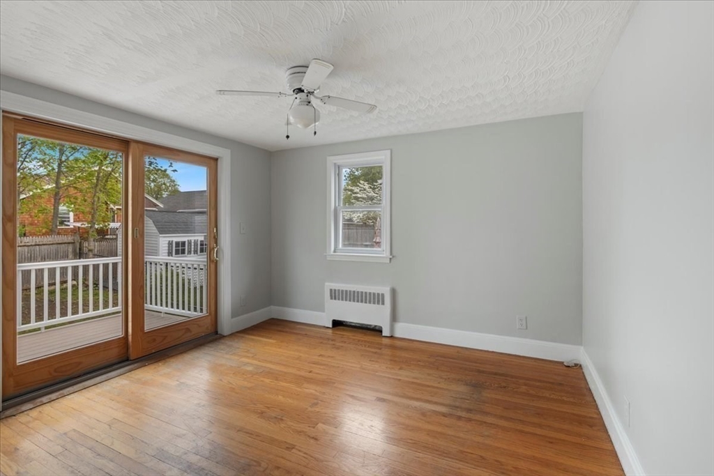 7 G Street Hull, MA 02045 - Photo 18 of 34 wooden floor in an empty room with a window