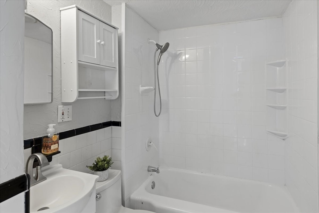 7 G Street Hull, MA 02045 - Photo 19 of 34 a bathroom with a bathtub and a shower
