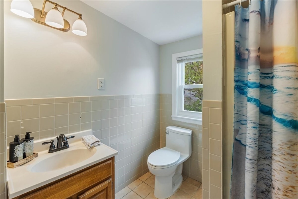 7 G Street Hull, MA 02045 - Photo 21 of 34 a bathroom with a sink toilet and shower