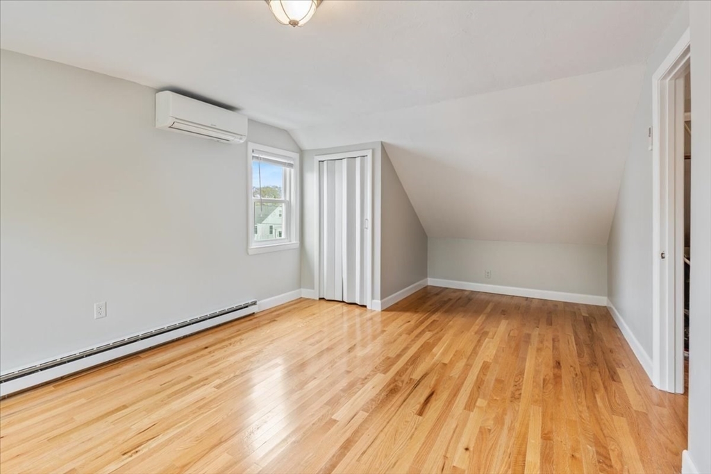 7 G Street Hull, MA 02045 - Photo 28 of 34 wooden floor in an empty room with a window