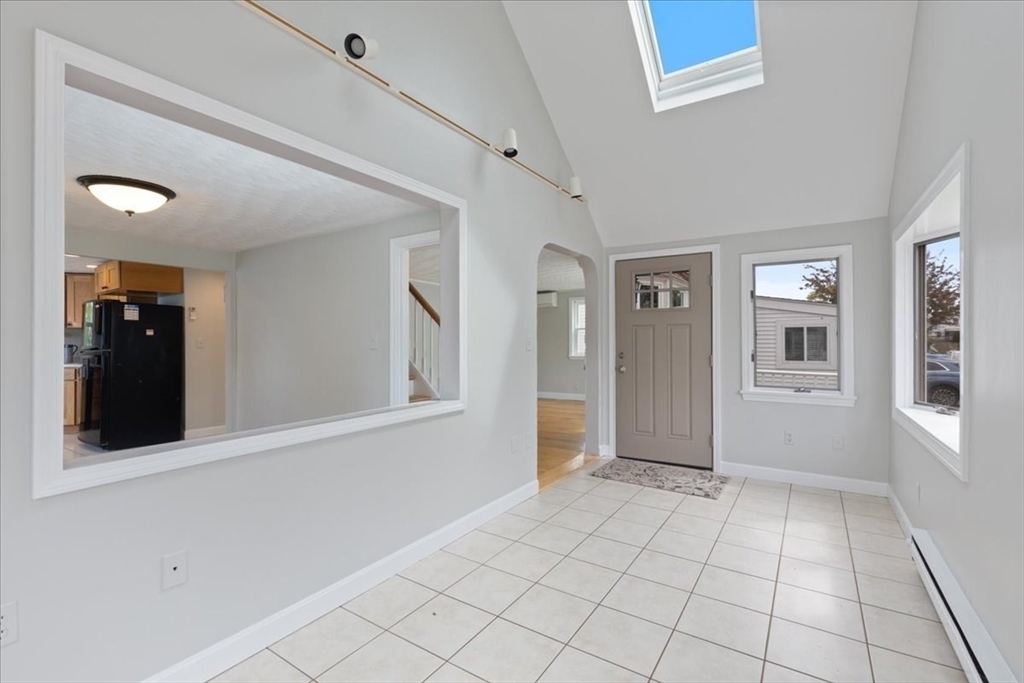 7 G Street Hull, MA 02045 - Photo 8 of 34 a view of an empty room with window and stairs