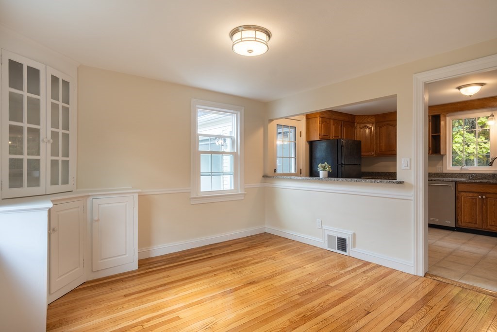 90 Hartwick Street Springfield, MA 01108 - Photo 11 of 33 a view of empty room with a window and wooden floor