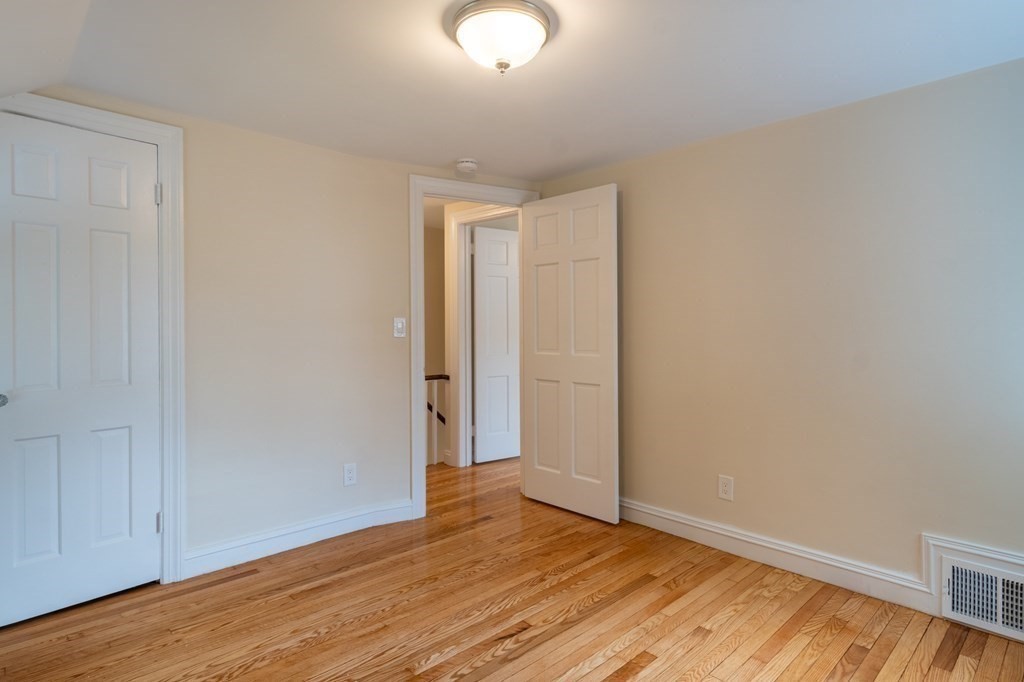 90 Hartwick Street Springfield, MA 01108 - Photo 19 of 33 a view of an empty room with wooden floor