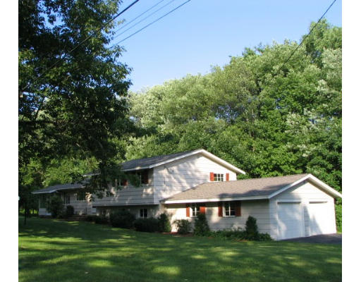25 Linda Road Andover, MA 01810 - Photo 1 of 8 a front view of a house with a yard balcony and trees