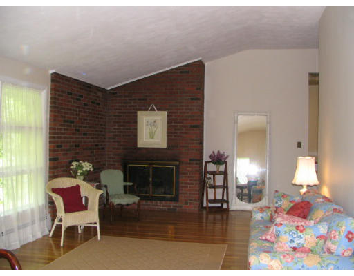 25 Linda Road Andover, MA 01810 - Photo 3 of 8 a living room with furniture and a fireplace