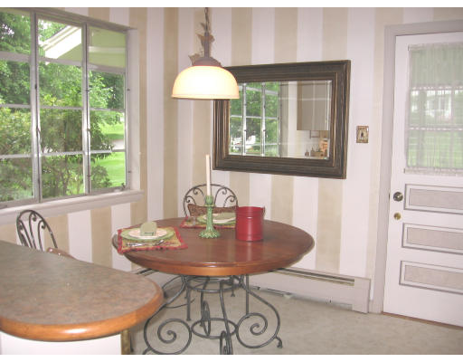 25 Linda Road Andover, MA 01810 - Photo 4 of 8 a view of a dining room with furniture window and outside view
