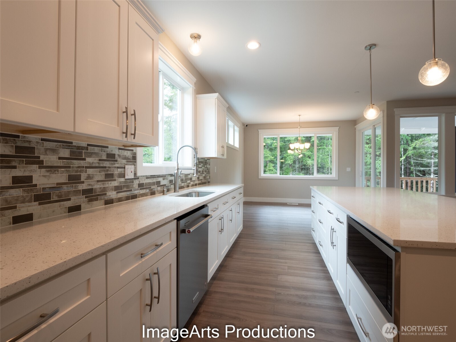0 Herron Road Northwest Lakebay, WA 98349 - Photo 12 of 24 a large kitchen with stainless steel appliances granite countertop a sink and window