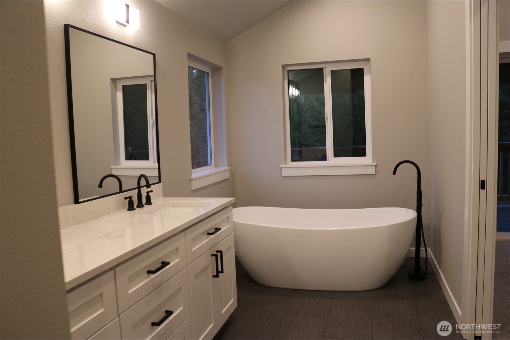 0 Herron Road Northwest Lakebay, WA 98349 - Photo 23 of 24 a white bath tub sitting next to a bathroom sink