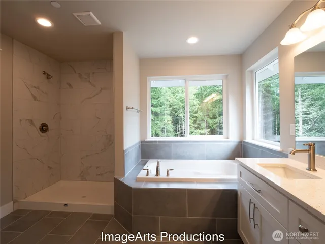 a bathroom with a bathtub and a sink