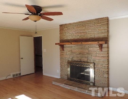 3005 Hickory Road Raleigh, NC 27616 - Photo 4 of 25 a living room with a fireplace