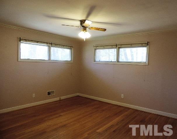 3005 Hickory Road Raleigh, NC 27616 - Photo 7 of 25 a view of a room with wooden floor and fan