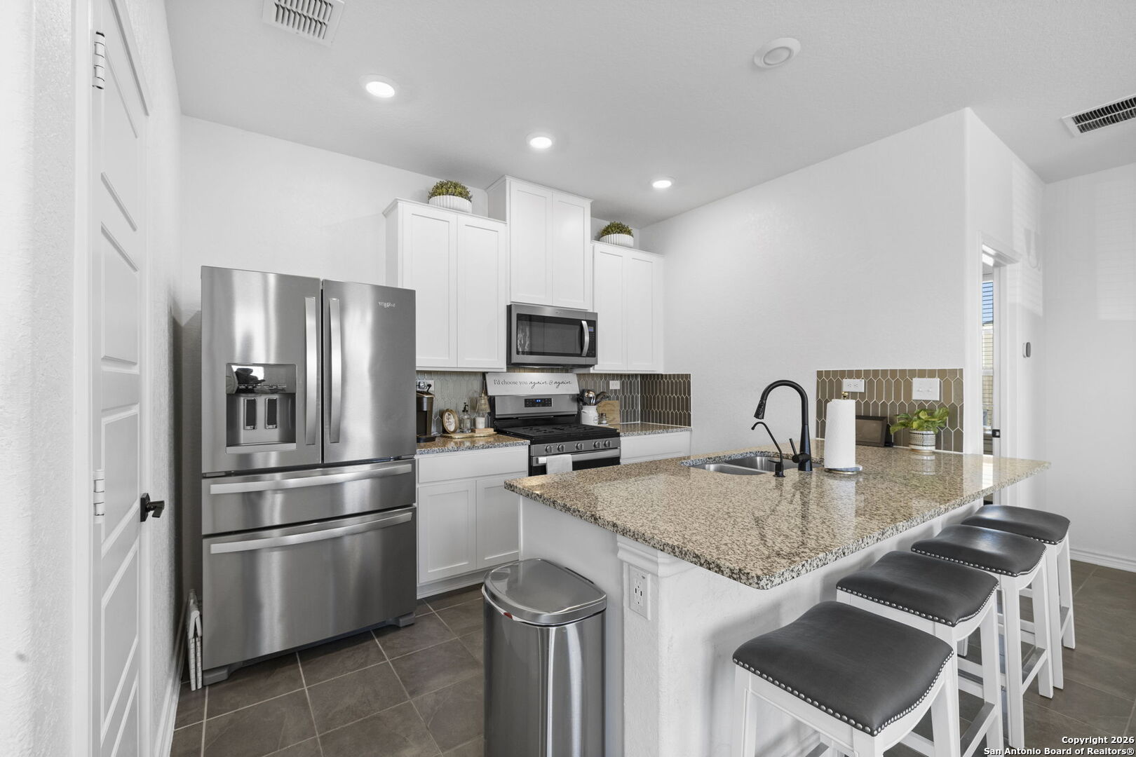 4931 Park Marion, TX 78124 - Photo 8 of 20 a kitchen with stainless steel appliances granite countertop a sink refrigerator and microwave