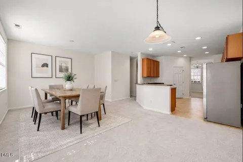 a dining room with furniture and window