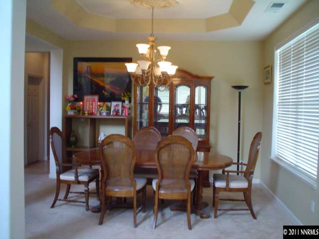 10140 Canyon Country Road Reno, NV 89521 - Photo 3 of 13 a dining room with furniture and window