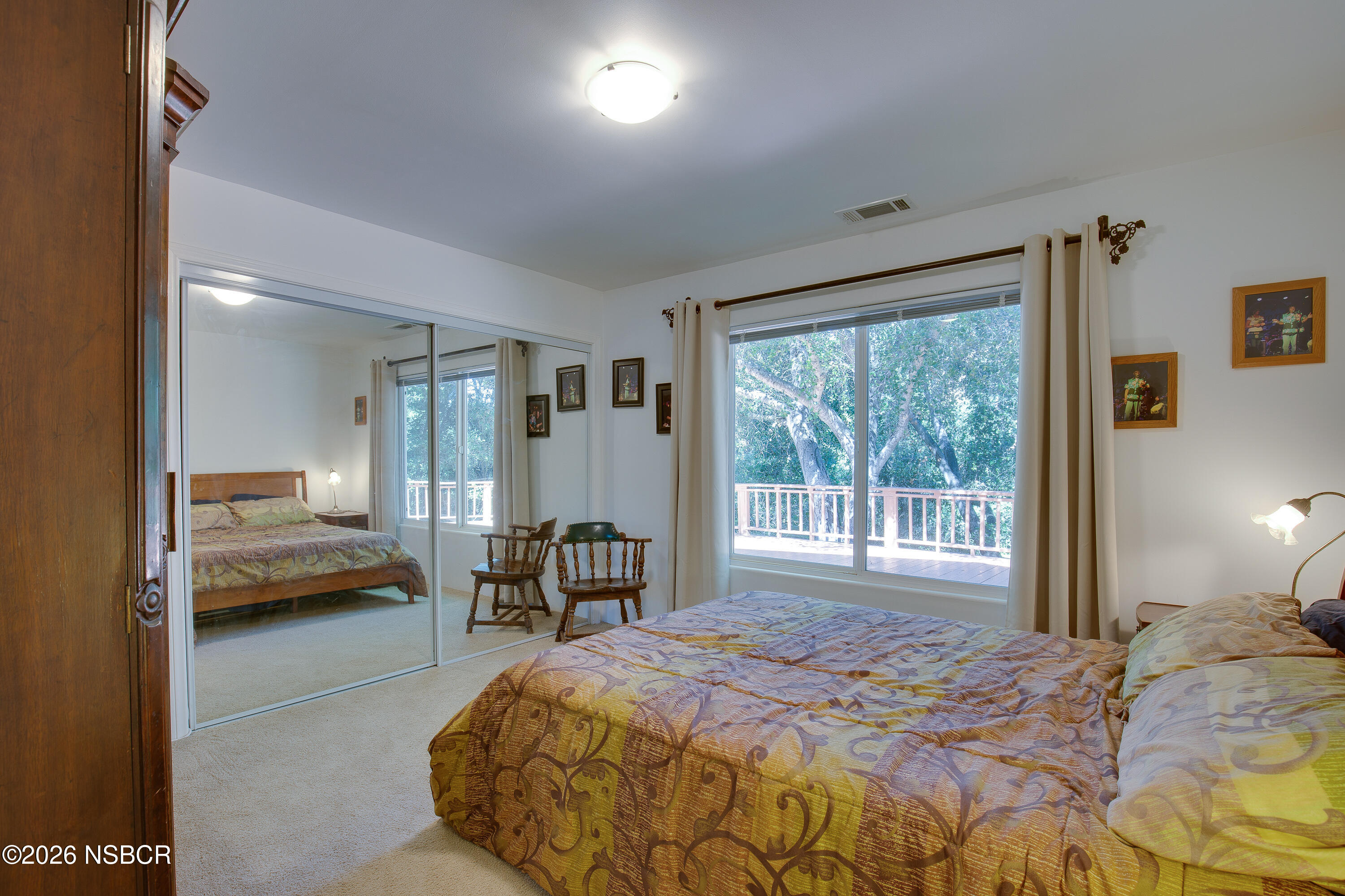 850 Fredensborg Canyon Road Solvang, CA 93463 - Photo 11 of 26 a bedroom with a bed and a large window