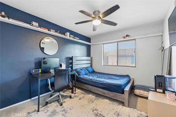 a living room with a bed furniture and a window