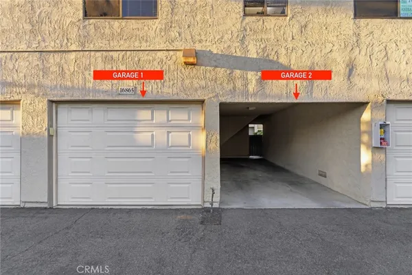 a street sign on a brick wall