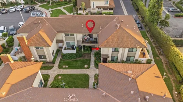 an aerial view of residential houses with outdoor space and street view