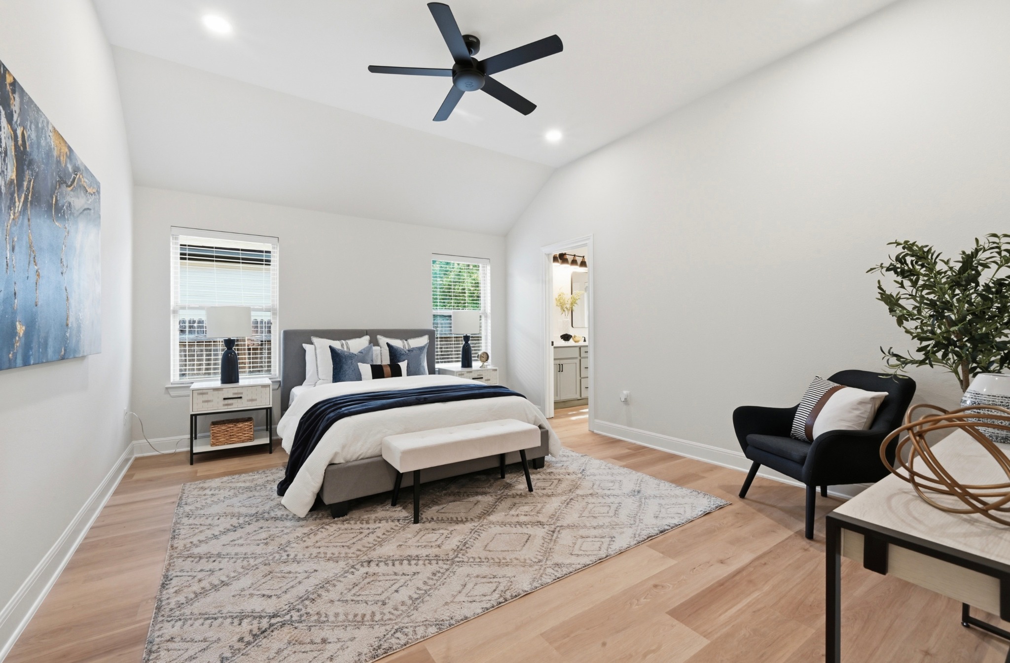 13009 Olivers Way Manchaca, TX 78652 - Photo 17 of 37 a spacious bedroom with a bed and a potted plant