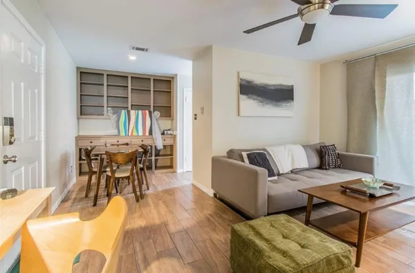 a living room with furniture and a window