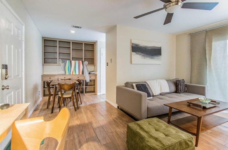 6903 Deatonhill Drive, Unit 22 Austin, TX 78745 - Photo 1 of 12 a living room with furniture and a window