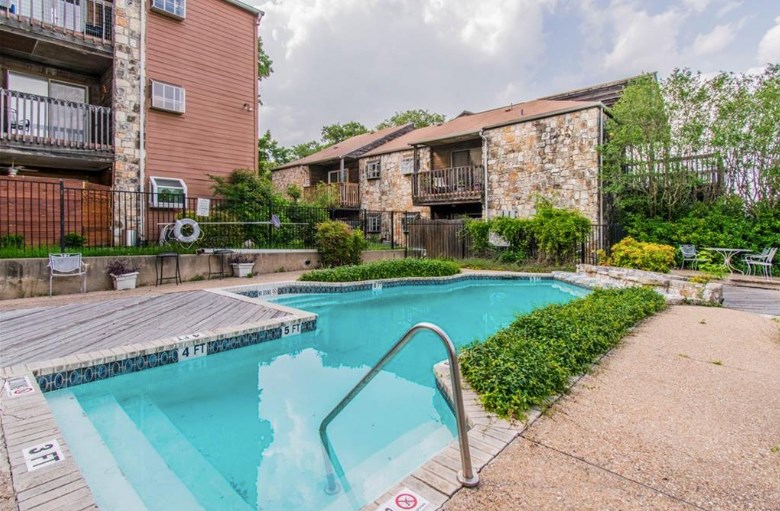 6903 Deatonhill Drive, Unit 22 Austin, TX 78745 - Photo 11 of 12 a aerial view of a house with swimming pool and green space