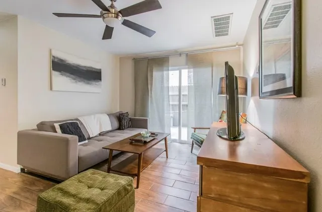 a living room with furniture and a window