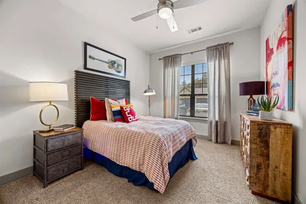 a kitchen with stainless steel appliances kitchen island granite countertop a refrigerator stove and sink