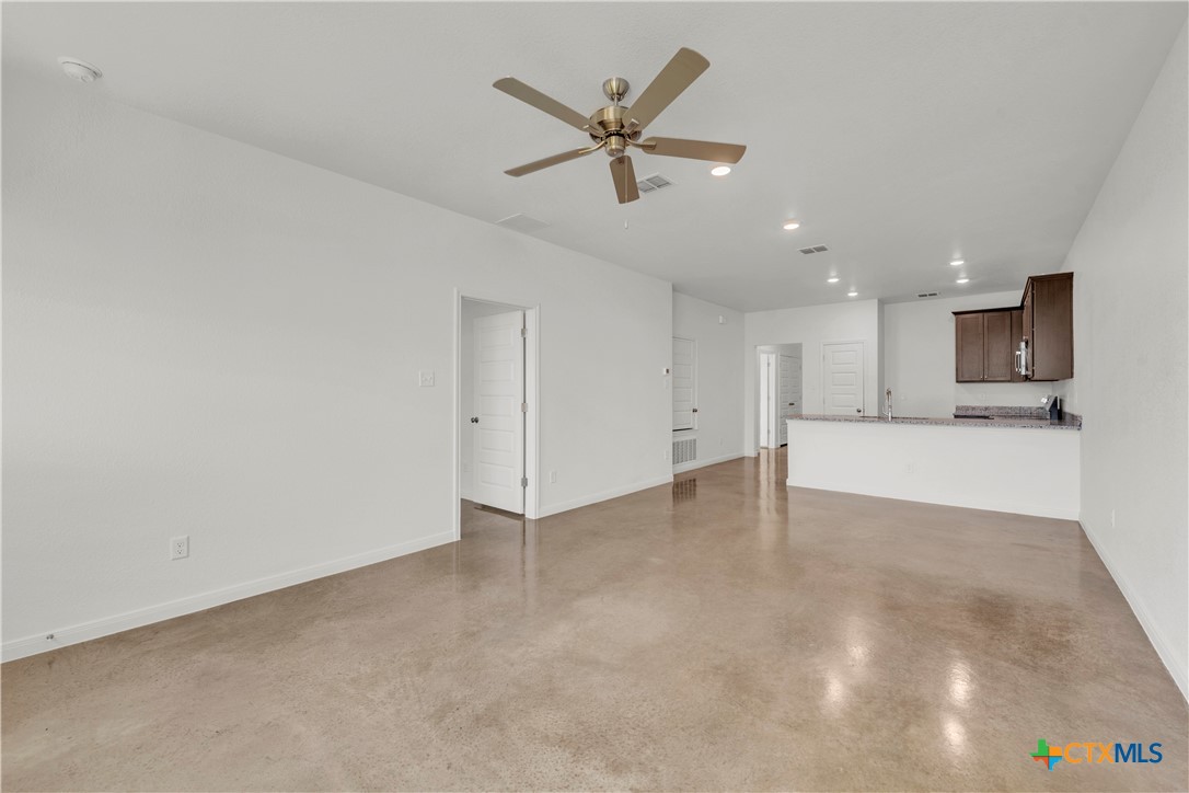 2906 Quail Rdg Lane Temple, TX 76501 - Photo 8 of 17 a view of an empty room with a kitchen