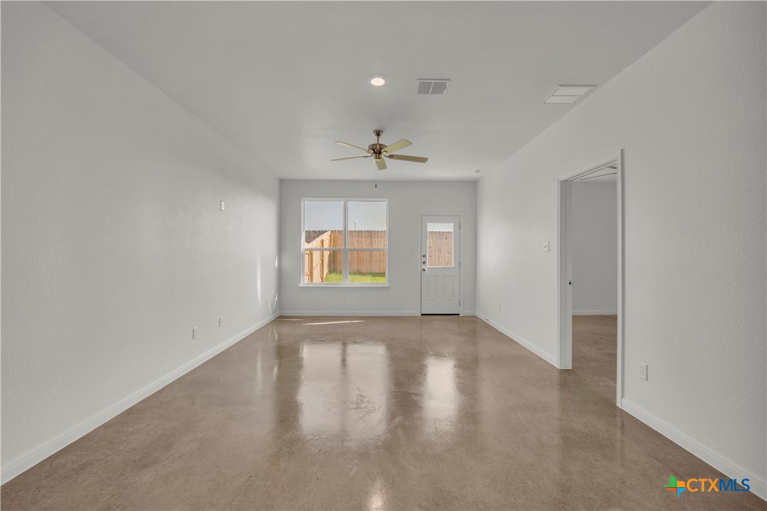 2906 Quail Rdg Lane Temple, TX 76501 - Photo 9 of 17 wooden floor in an empty room with a window
