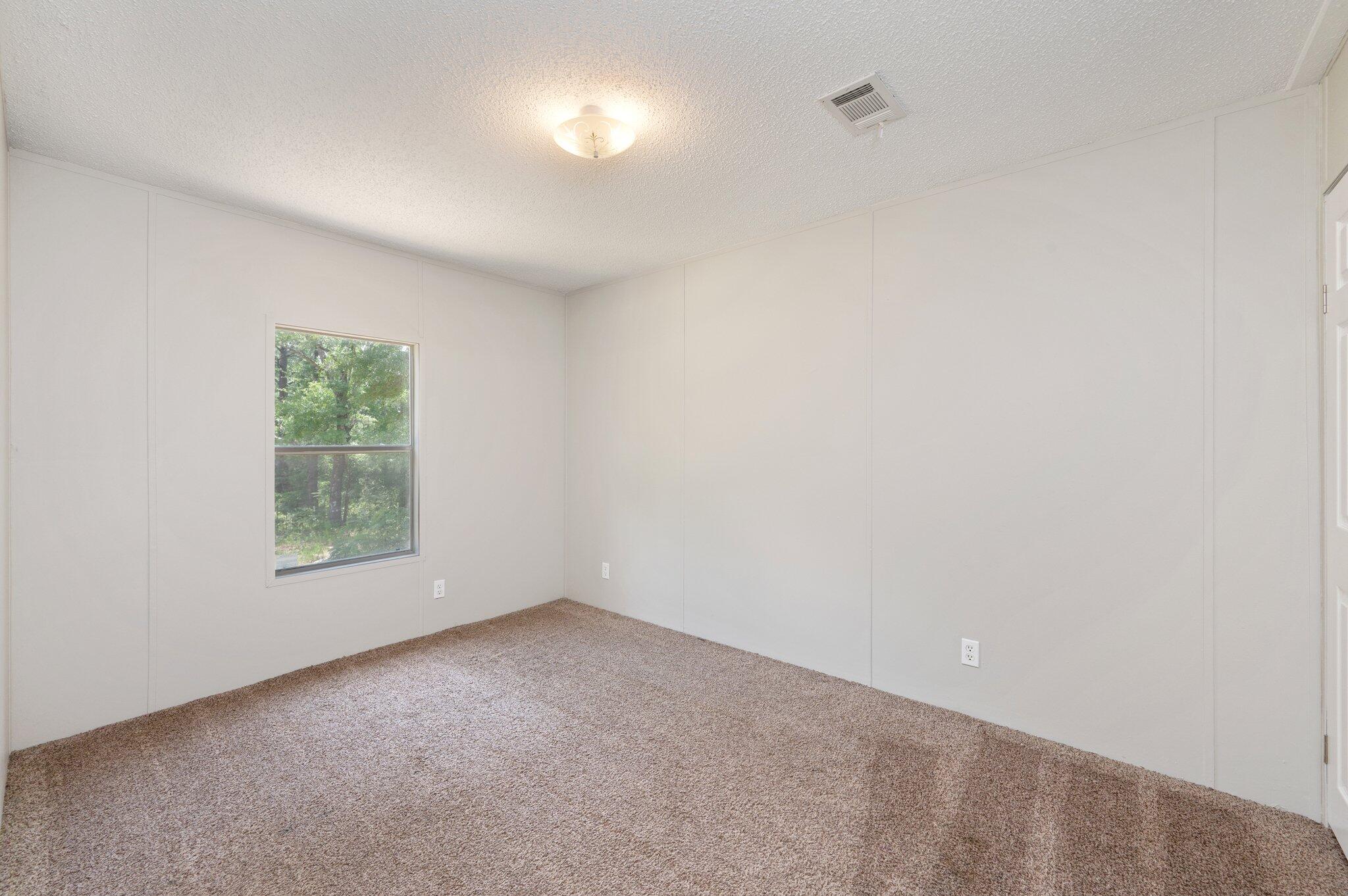 4231 Painter Branch Road Crestview, FL 32539 - Photo 19 of 39 a view of a window in an empty room