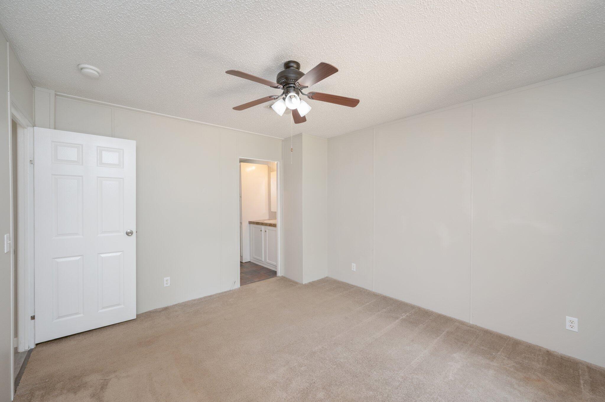 4231 Painter Branch Road Crestview, FL 32539 - Photo 8 of 39 a view of a ceiling fan in a room