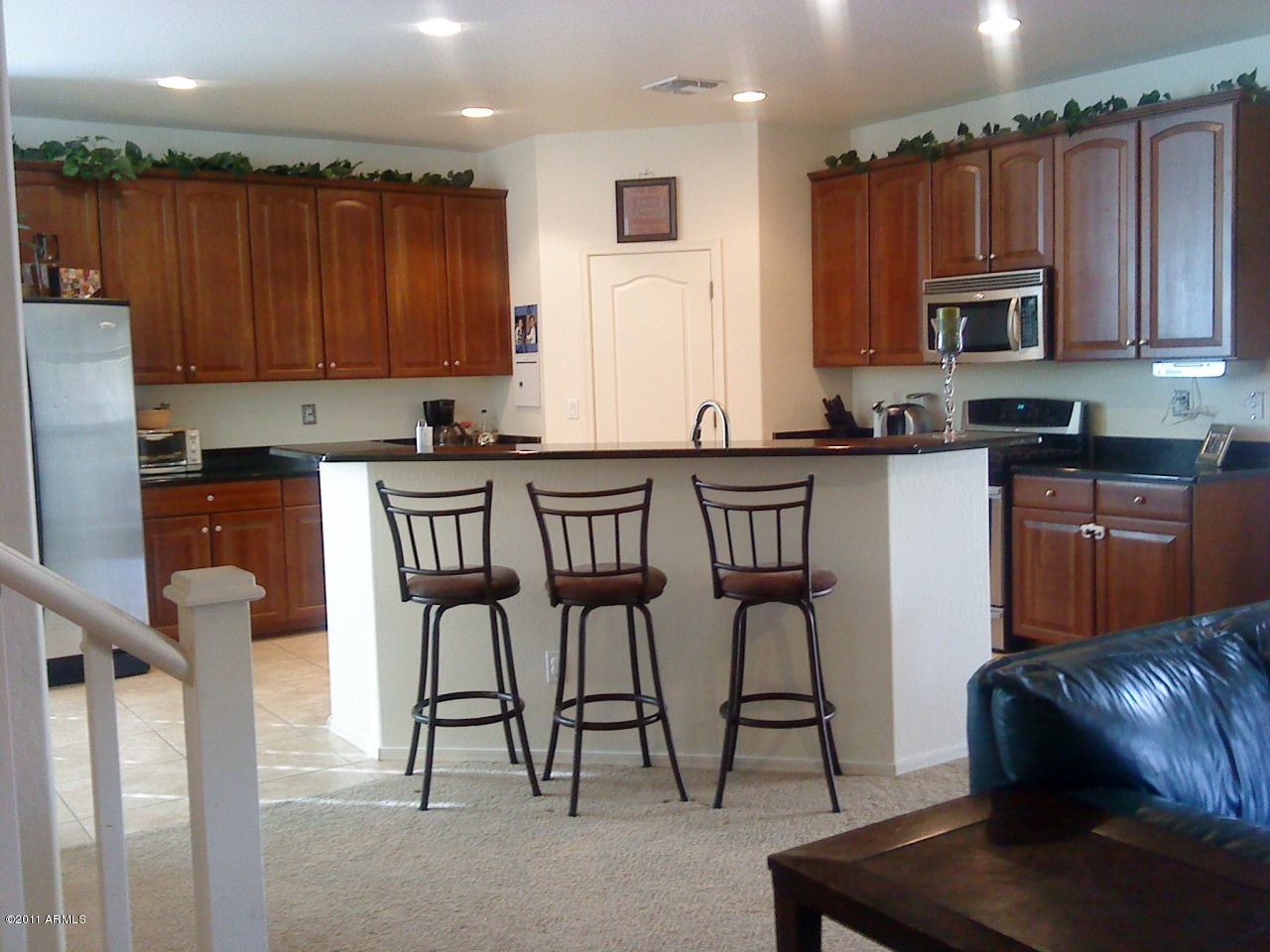 17416 West Red Bird Road Surprise, AZ 85387 - Photo 3 of 6 Kitchen Island with Bar Stool Area