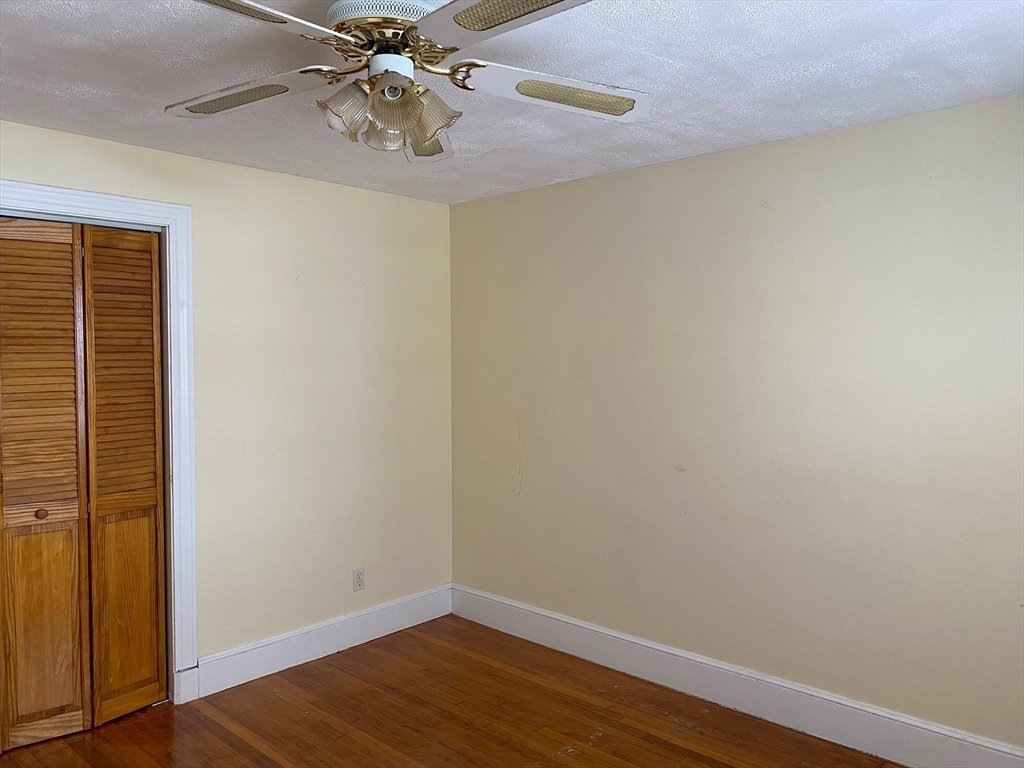460 A Highland Avenue, Unit 2 Malden, MA 02148 - Photo 4 of 7 a view of an empty room with wooden floor