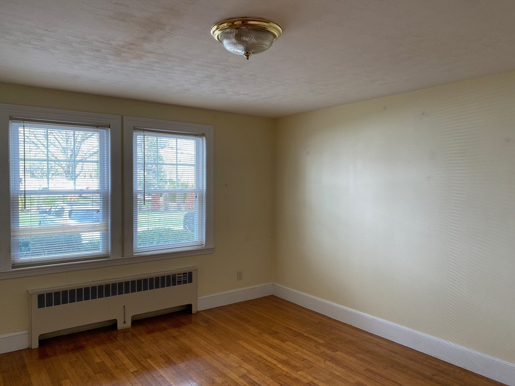 460 A Highland Avenue, Unit 2 Malden, MA 02148 - Photo 5 of 7 an empty room with a window
