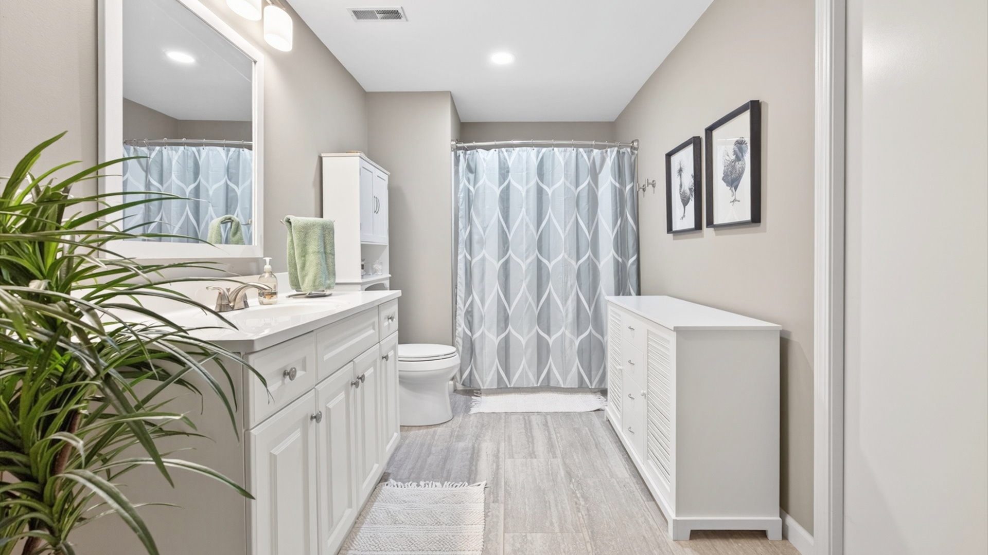 308 East Locust Street Normal, IL 61761 - Photo 21 of 40 a bathroom with a sink a toilet and a mirror