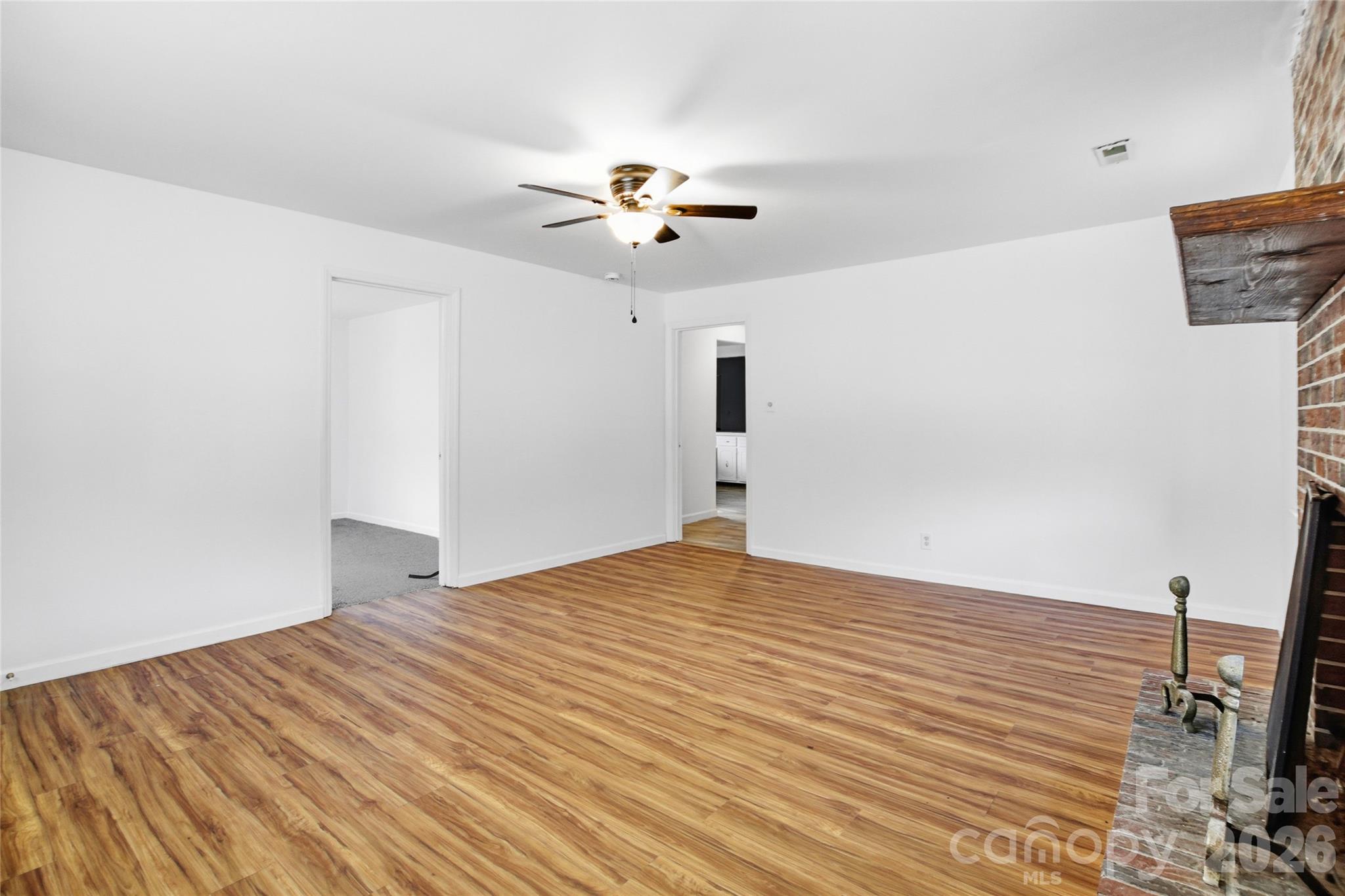 213 Jewel Street Chester, SC 29706 - Photo 5 of 21 a bedroom with a bed and a chandelier