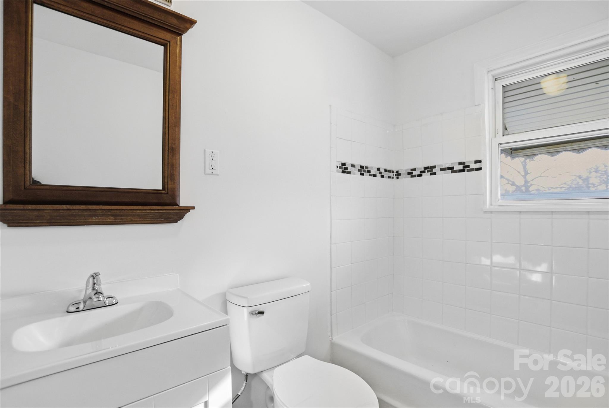 213 Jewel Street Chester, SC 29706 - Photo 7 of 21 a bathroom with a sink toilet and shower