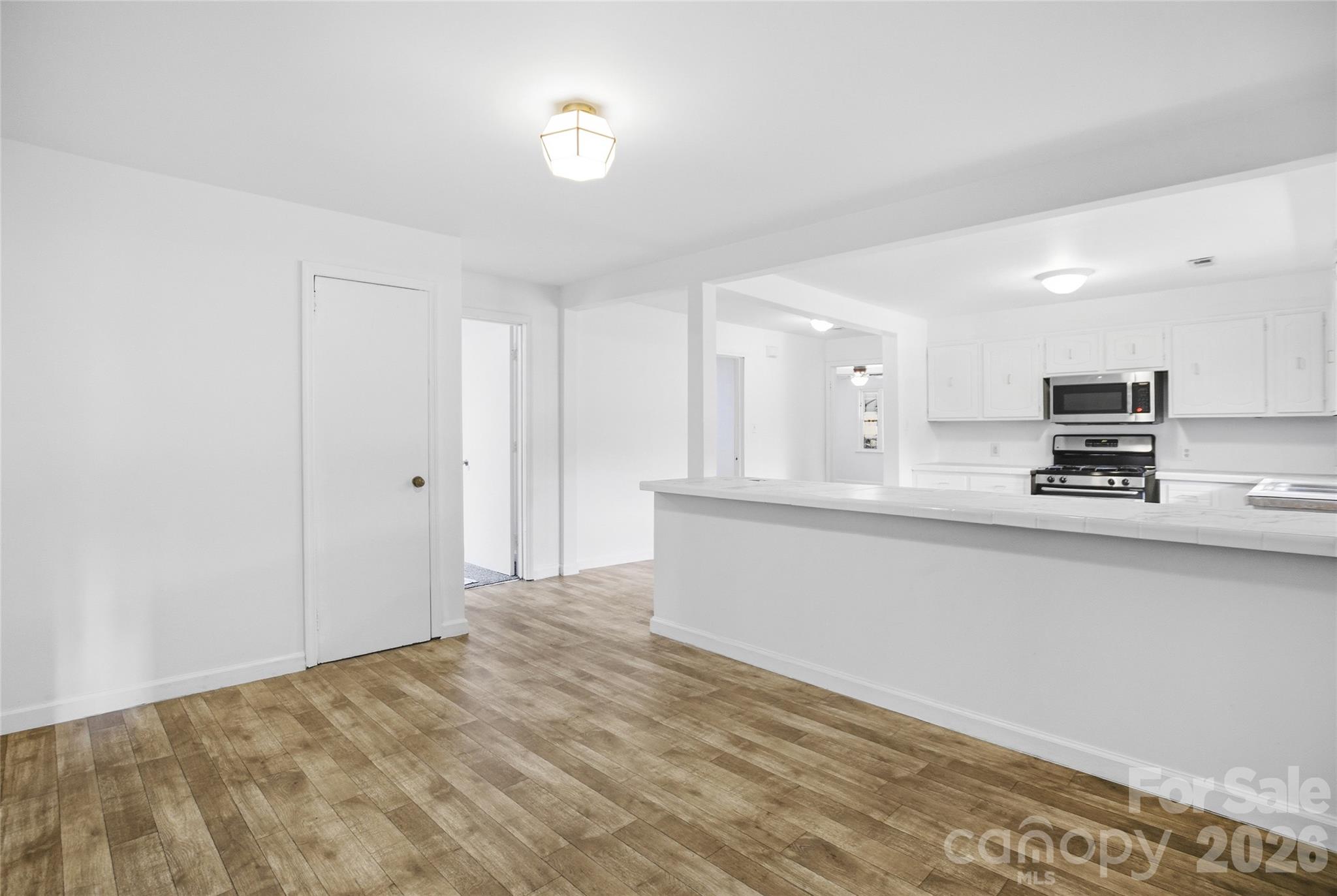 213 Jewel Street Chester, SC 29706 - Photo 10 of 21 a view of kitchen with wooden floor and electronic appliances