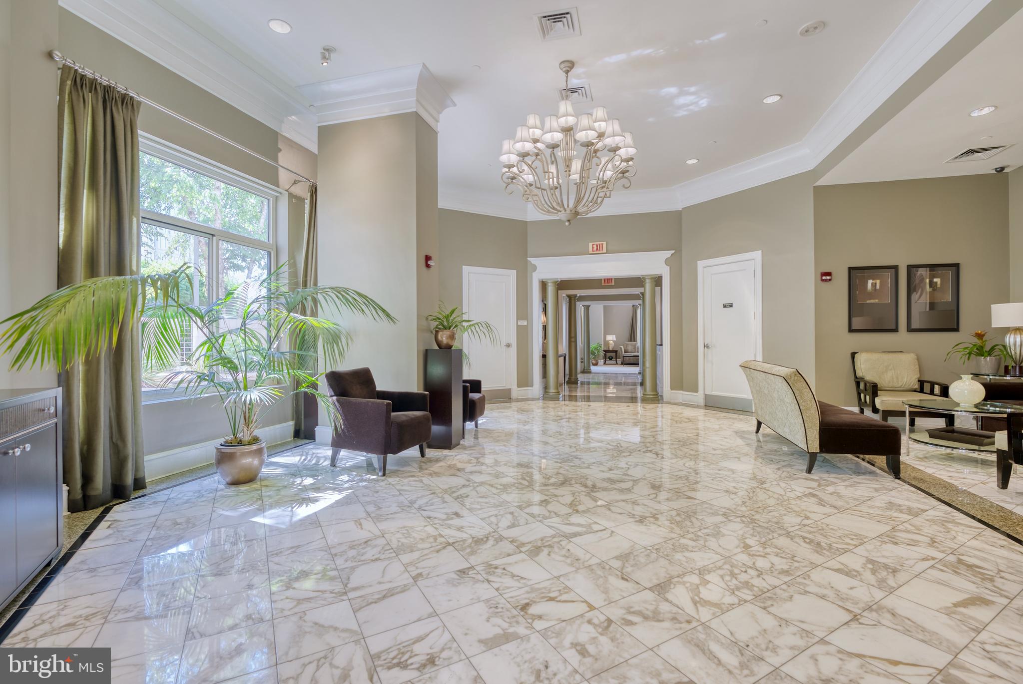 851 North Glebe Road, Unit 1514 Arlington, VA 22203 - Photo 29 of 47 a living room with furniture a chandelier and a large window