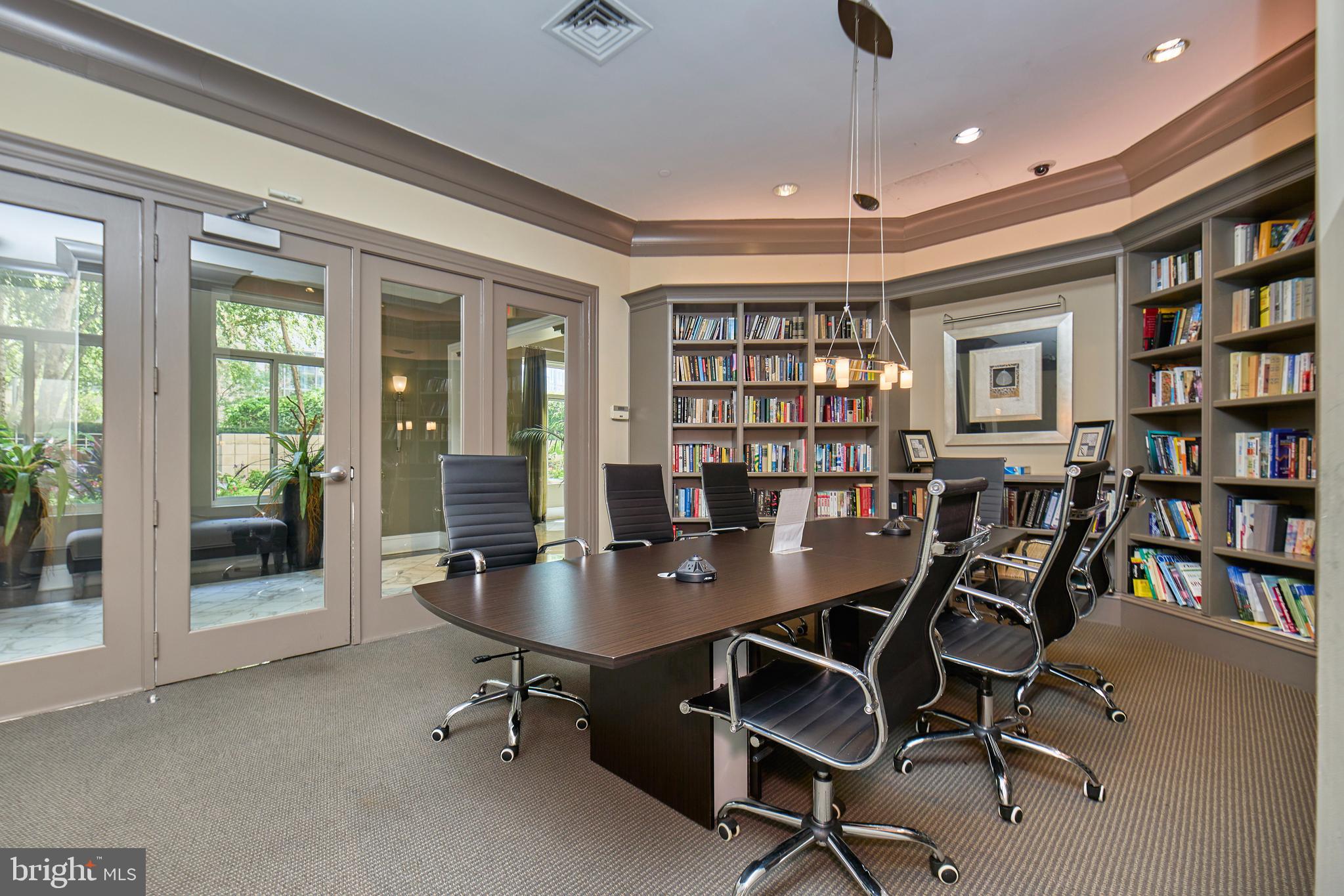851 North Glebe Road, Unit 1514 Arlington, VA 22203 - Photo 30 of 47 a workspace with lots of furniture and a book shelf