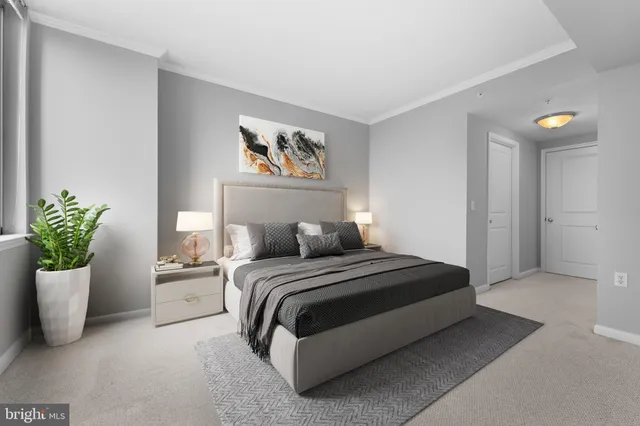 a bedroom with a bed and a potted plant