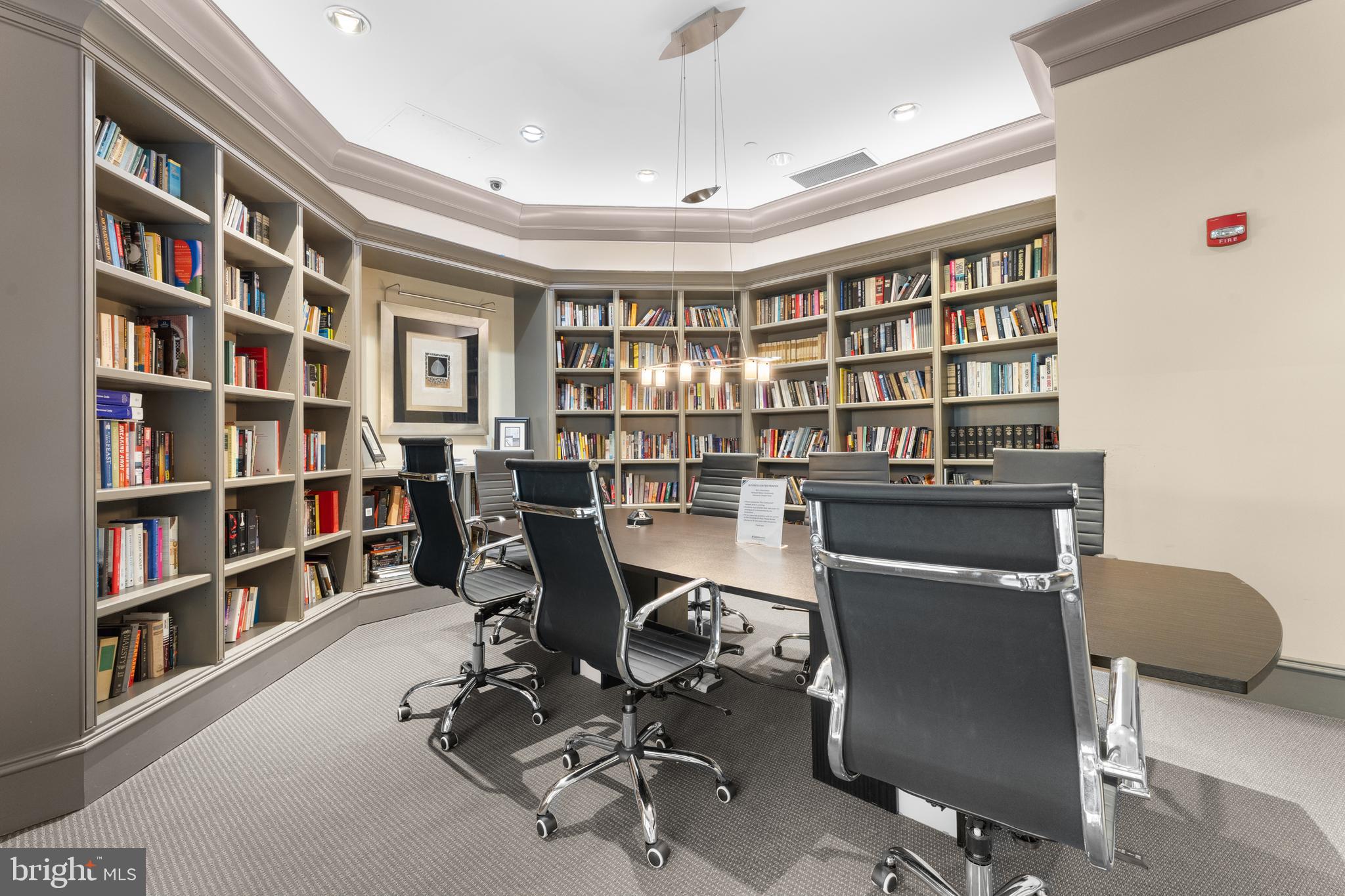 851 North Glebe Road, Unit 1514 Arlington, VA 22203 - Photo 31 of 47 a view of a workspace with furniture and a bookshelf